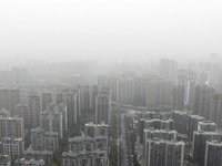 City buildings are looming under smog in Xi'an, Shaanxi Province, China, on March 16, 2024. (