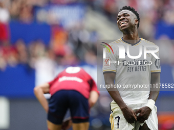 Vinicius Junior left winger of Real Madrid and Brazil lament a failed occasion during the LaLiga EA Sports match between CA Osasuna and Real...