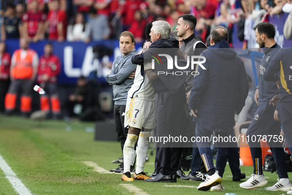 Vinicius Junior left winger of Real Madrid and Brazil  and Carlo Ancelotti head coach of Real Madrid greets each other during the LaLiga EA...