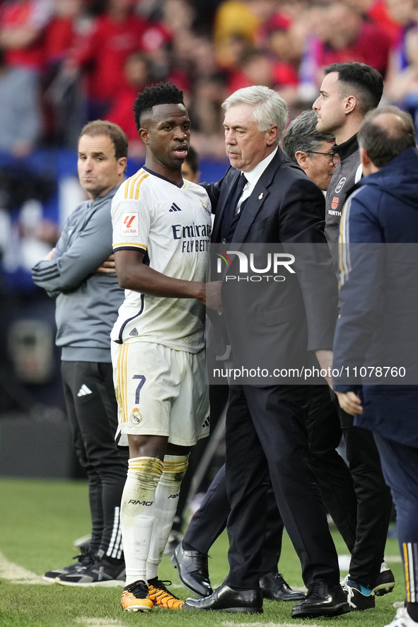 Vinicius Junior left winger of Real Madrid and Brazil  and Carlo Ancelotti head coach of Real Madrid greets each other during the LaLiga EA...