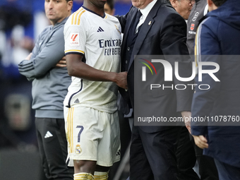 Vinicius Junior left winger of Real Madrid and Brazil  and Carlo Ancelotti head coach of Real Madrid greets each other during the LaLiga EA...