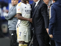 Vinicius Junior left winger of Real Madrid and Brazil  and Carlo Ancelotti head coach of Real Madrid greets each other during the LaLiga EA...