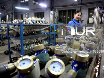 A worker is producing foreign trade products on a workshop production line at a spandex company in the Lianyungang Economic and Technologica...