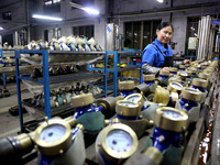 A worker is producing foreign trade products on a workshop production line at a spandex company in the Lianyungang Economic and Technologica...