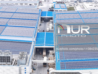 An aerial photo is being taken at the Tianhe solar energy base (Phase 1 and Phase 2) in Huai'an, China, on March 18, 2024. (