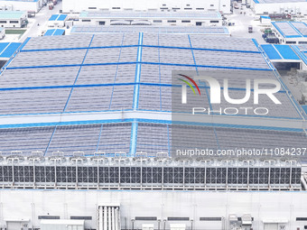 An aerial photo is being taken at the Tianhe solar energy base (Phase 1 and Phase 2) in Huai'an, China, on March 18, 2024. (