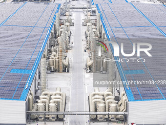 An aerial photo is being taken at the Tianhe solar energy base (Phase 1 and Phase 2) in Huai'an, China, on March 18, 2024. (