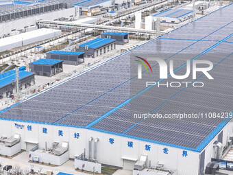 An aerial photo is being taken at the Tianhe solar energy base (Phase 1 and Phase 2) in Huai'an, China, on March 18, 2024. (