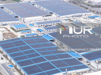 An aerial photo is being taken at the Tianhe solar energy base (Phase 1 and Phase 2) in Huai'an, China, on March 18, 2024. (