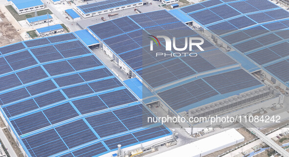 An aerial photo is being taken at the Tianhe solar energy base (Phase 1 and Phase 2) in Huai'an, China, on March 18, 2024. 