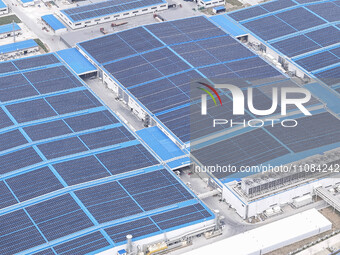 An aerial photo is being taken at the Tianhe solar energy base (Phase 1 and Phase 2) in Huai'an, China, on March 18, 2024. (