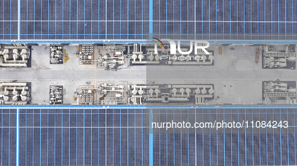 An aerial photo is being taken at the Tianhe solar energy base (Phase 1 and Phase 2) in Huai'an, China, on March 18, 2024. 