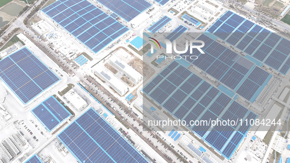 An aerial photo is being taken at the Tianhe solar energy base (Phase 1 and Phase 2) in Huai'an, China, on March 18, 2024. 