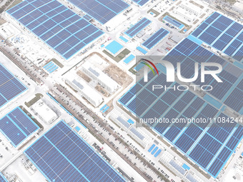 An aerial photo is being taken at the Tianhe solar energy base (Phase 1 and Phase 2) in Huai'an, China, on March 18, 2024. (