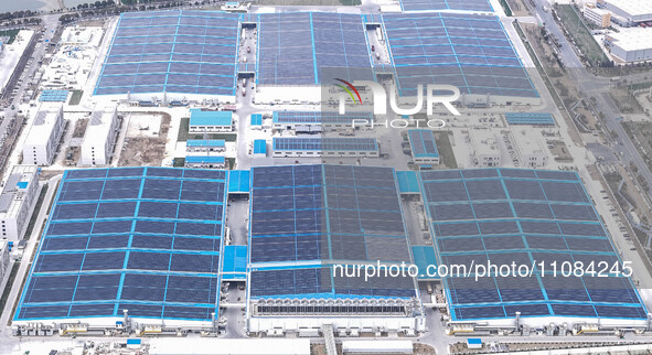 An aerial photo is being taken at the Tianhe solar energy base (Phase 1 and Phase 2) in Huai'an, China, on March 18, 2024. 