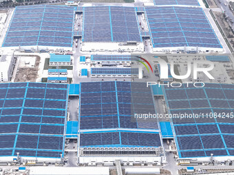 An aerial photo is being taken at the Tianhe solar energy base (Phase 1 and Phase 2) in Huai'an, China, on March 18, 2024. (