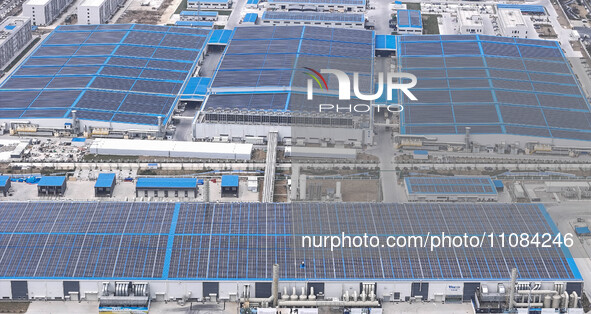 An aerial photo is being taken at the Tianhe solar energy base (Phase 1 and Phase 2) in Huai'an, China, on March 18, 2024. 