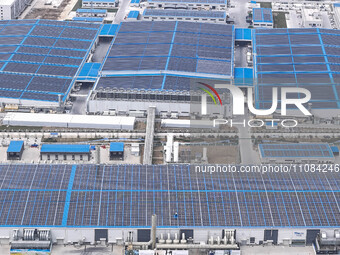 An aerial photo is being taken at the Tianhe solar energy base (Phase 1 and Phase 2) in Huai'an, China, on March 18, 2024. (