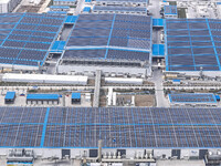 An aerial photo is being taken at the Tianhe solar energy base (Phase 1 and Phase 2) in Huai'an, China, on March 18, 2024. (