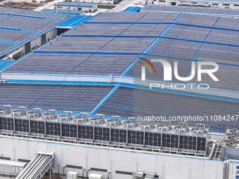 An aerial photo is being taken at the Tianhe solar energy base (Phase 1 and Phase 2) in Huai'an, China, on March 18, 2024. (