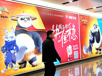 Passengers are walking past a light box advertising ''looking for jobs'' at Dawanglu Metro station in Beijing, China, on March 17, 2024. (