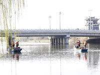 Cleaners are cleaning garbage on the Bian River to mark the upcoming World Water Day in Suqian, Jiangsu Province, China, on March 20, 2024....