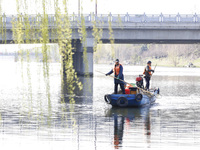 Cleaners are cleaning garbage on the Bian River to mark the upcoming World Water Day in Suqian, Jiangsu Province, China, on March 20, 2024....