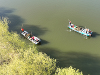 Cleaners are cleaning garbage on the Bian River to mark the upcoming World Water Day in Suqian, Jiangsu Province, China, on March 20, 2024....