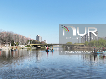 Cleaners are cleaning garbage on the Bian River to mark the upcoming World Water Day in Suqian, Jiangsu Province, China, on March 20, 2024....