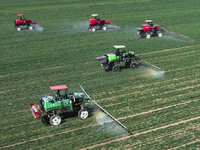 Farmers are spraying on a family ecological farm in Zouping, Shandong Province, China, on March 20, 2024. (