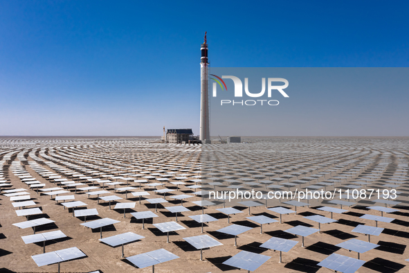 In Jiuquan, China, on March 18, 2024, an aerial photo shows the Jinta Zhongguang Solar 100,000kw solar thermal + 600,000kW photovoltaic proj...