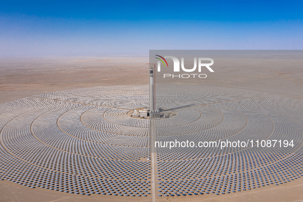 In Jiuquan, China, on March 18, 2024, an aerial photo shows the Jinta Zhongguang Solar 100,000kw solar thermal + 600,000kW photovoltaic proj...