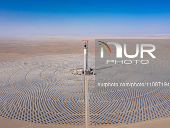 In Jiuquan, China, on March 18, 2024, an aerial photo shows the Jinta Zhongguang Solar 100,000kw solar thermal + 600,000kW photovoltaic proj...