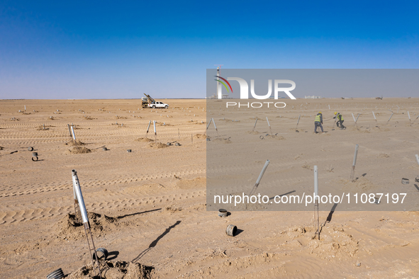 In Jiuquan, China, on March 18, 2024, an aerial photo shows the Jinta Zhongguang Solar 100,000kw solar thermal + 600,000kW photovoltaic proj...