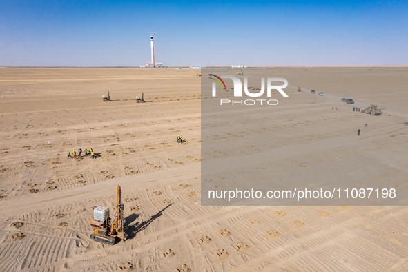 In Jiuquan, China, on March 18, 2024, an aerial photo shows the Jinta Zhongguang Solar 100,000kw solar thermal + 600,000kW photovoltaic proj...