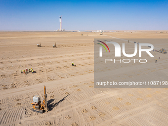 In Jiuquan, China, on March 18, 2024, an aerial photo shows the Jinta Zhongguang Solar 100,000kw solar thermal + 600,000kW photovoltaic proj...