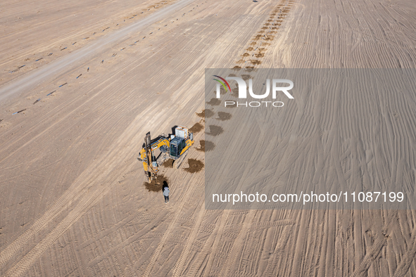 In Jiuquan, China, on March 18, 2024, an aerial photo shows the Jinta Zhongguang Solar 100,000kw solar thermal + 600,000kW photovoltaic proj...