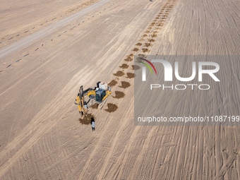 In Jiuquan, China, on March 18, 2024, an aerial photo shows the Jinta Zhongguang Solar 100,000kw solar thermal + 600,000kW photovoltaic proj...