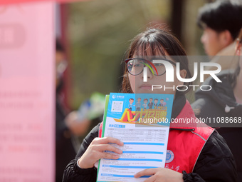 College students are looking for jobs at a spring job fair at Siyuan Square on the Xiangshan campus of Huaibei Normal University in Huaibei,...