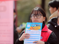 College students are looking for jobs at a spring job fair at Siyuan Square on the Xiangshan campus of Huaibei Normal University in Huaibei,...