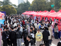 College students are looking for jobs at a spring job fair at Siyuan Square on the Xiangshan campus of Huaibei Normal University in Huaibei,...