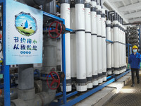 A power plant worker is walking past an ion exchanger that enables the reuse of return water in Zouping, Shandong Province, China, on March...