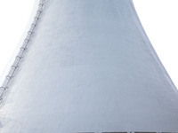 A power plant worker is walking by a cool water tower, which has achieved zero discharge of circulating water, in Zouping, Shandong province...