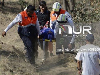 Members of Civil Protection are rescuing a person who suffered a fall while climbing Cerro de la Estrella in the Iztapalapa mayor's office i...