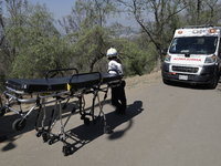 Members of Civil Protection are rescuing a person who suffered a fall while climbing Cerro de la Estrella in the Iztapalapa mayor's office i...