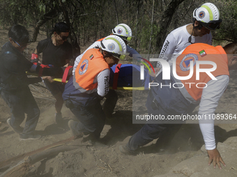 Members of Civil Protection are rescuing a person who suffered a fall while climbing Cerro de la Estrella in the Iztapalapa mayor's office i...