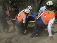 Members of Civil Protection are rescuing a person who suffered a fall while climbing Cerro de la Estrella in the Iztapalapa mayor's office i...