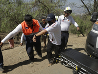 Members of Civil Protection are rescuing a person who suffered a fall while climbing Cerro de la Estrella in the Iztapalapa mayor's office i...