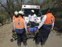 Members of Civil Protection are rescuing a person who suffered a fall while climbing Cerro de la Estrella in the Iztapalapa mayor's office i...