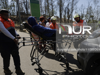 Members of Civil Protection are rescuing a person who suffered a fall while climbing Cerro de la Estrella in the Iztapalapa mayor's office i...